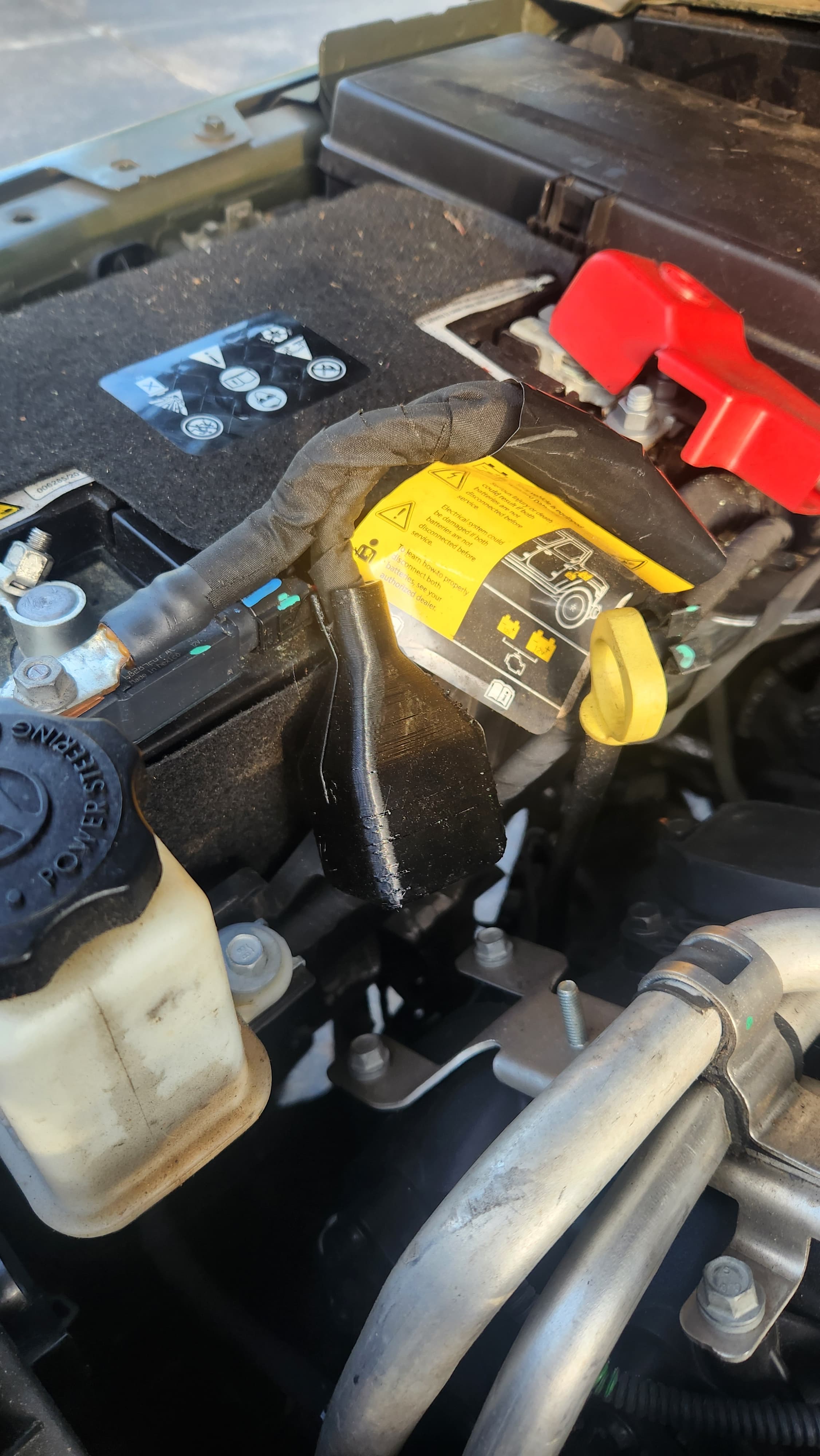Auxiliary-Battery Lead Insulator